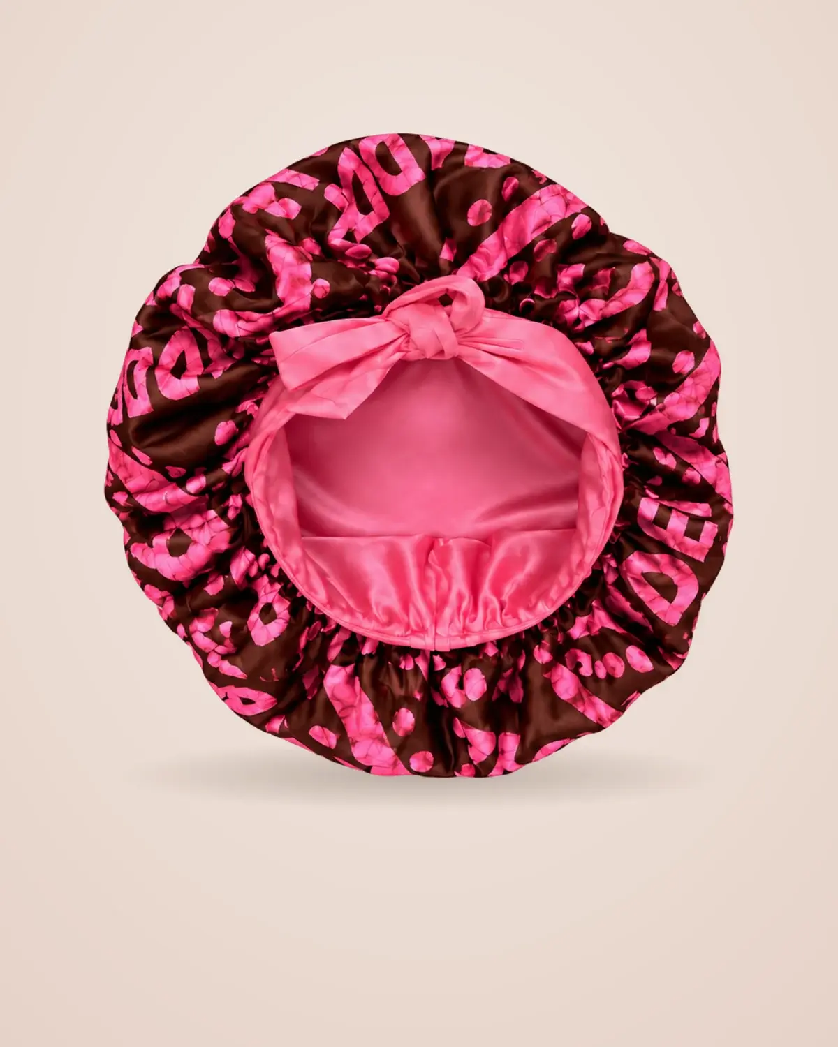 Pink satin lining and tie bow inside the Adé Bonnet